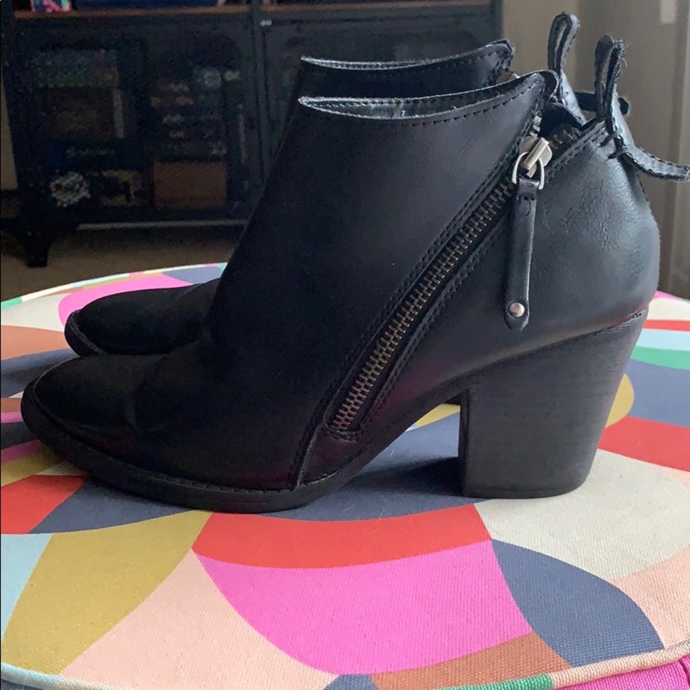 Black heeled ankle booties with zipper accent